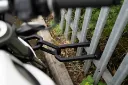 LI1AB-DX1AB-DXL1AB-Motorcycle-Locked-To-Fence-2.webp